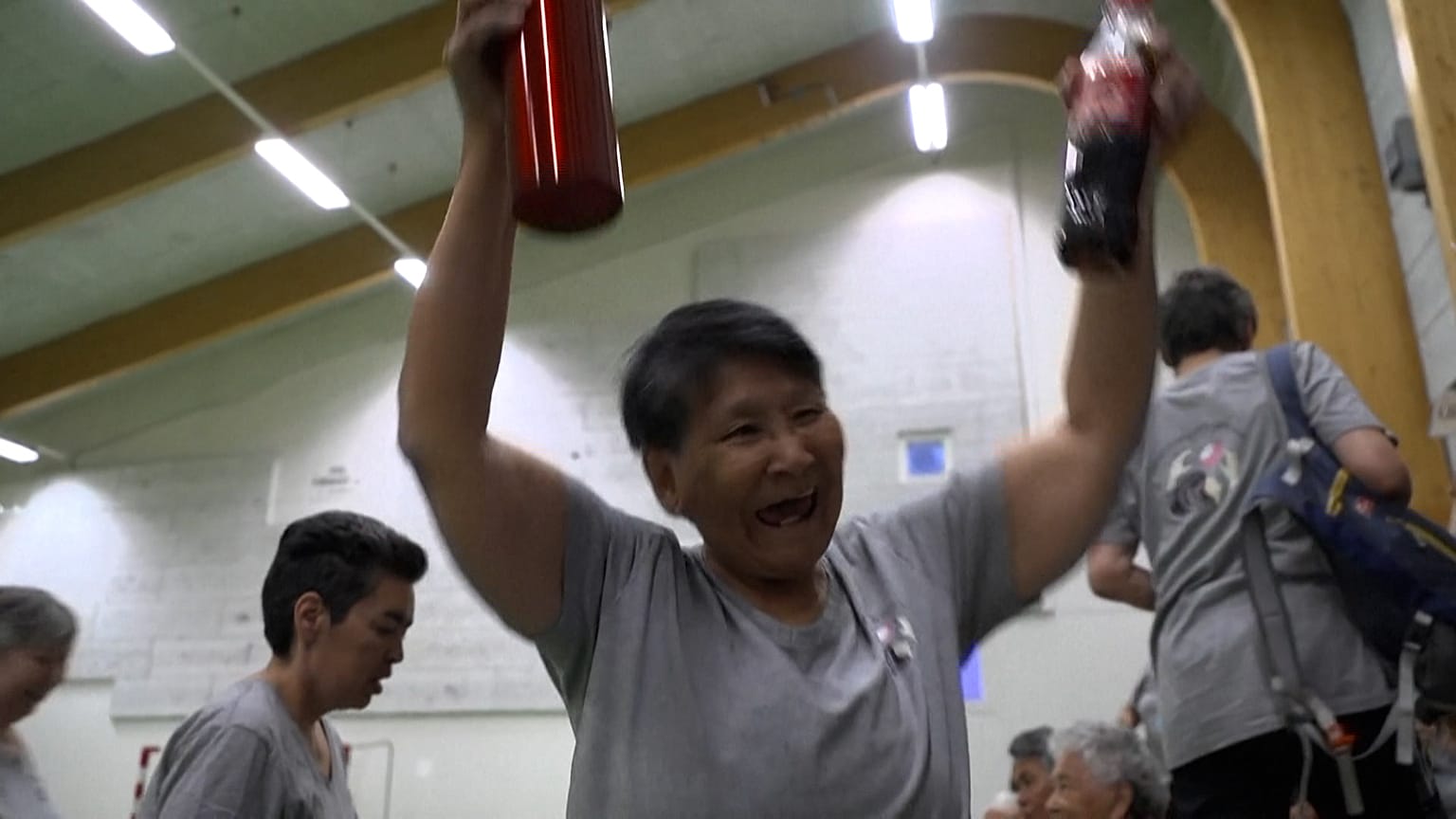 Teams cheering at a end of a game 