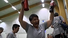 Teams cheering at a end of a game 