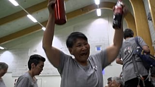 Teams cheering at a end of a game 