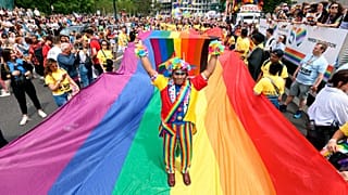 Mohammed Nazir poses during the Pride in London parade, in London, Saturday, July 2, 2022, marking the 50th Anniversary of the Pride movement
