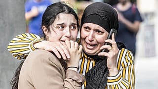 People react in front of the Field's shopping center in Copenhagen, Denmark Sunday, July 3, 2022.