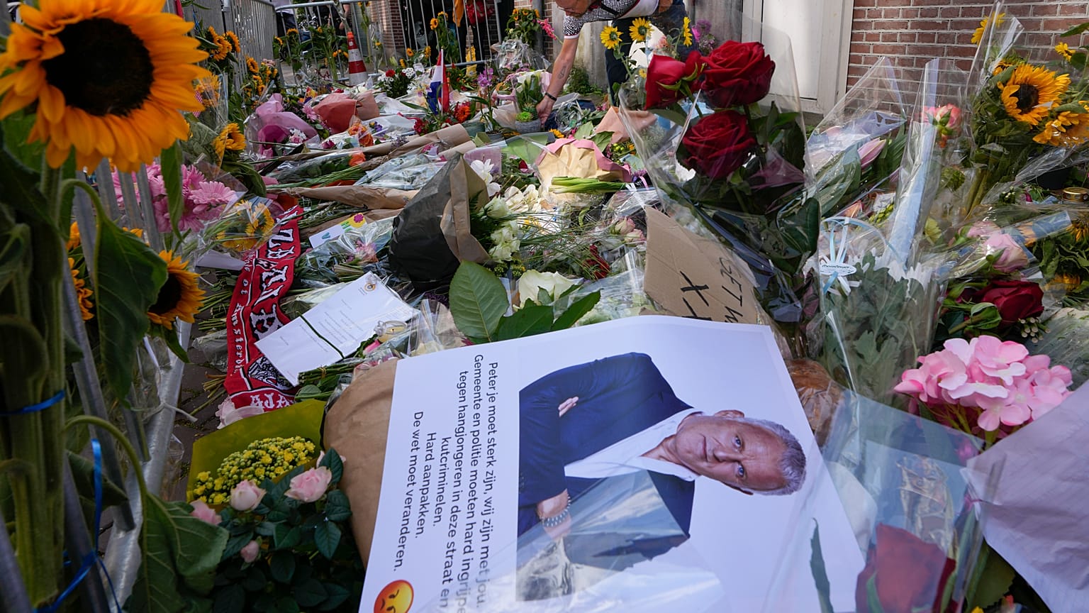 Tributes are placed at the spot where journalist Peter R. de Vries was shot in Amsterdam.
