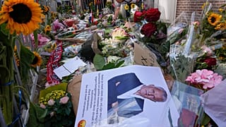 Tributes are placed at the spot where journalist Peter R. de Vries was shot in Amsterdam.