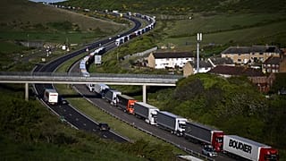 Freight lorries queue on the A20 road towards the Port of Dover on the southeast coast of England, April 26, 2022. Brexit trade checks have brought long delays. 