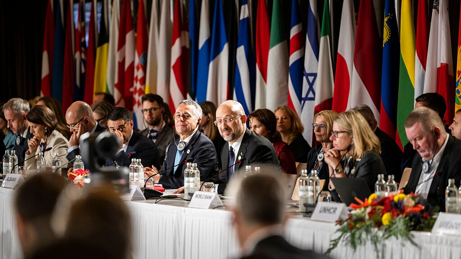 Swiss President Ignazio Cassis, Minister of Foreign Affairs, center left, and Ukrainian Prime Minister Denys Shmyhal, center right, participate in the round of national statem