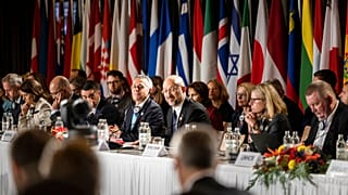 Swiss President Ignazio Cassis, Minister of Foreign Affairs, center left, and Ukrainian Prime Minister Denys Shmyhal, center right, participate in the round of national statem