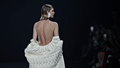 A model wears a creation as part of Stephane Rolland's Haute Couture Fall/Winter 2022-2023 fashion collection presented Tuesday, July 5, 2022 in Paris.