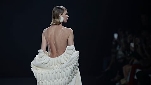 A model wears a creation as part of Stephane Rolland's Haute Couture Fall/Winter 2022-2023 fashion collection presented Tuesday, July 5, 2022 in Paris.