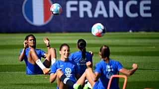 France's defender Wendie Renard (L) plays the ball during a training session at the team's base camp in Ashby-de-la-Zouch in central England, on July 5, 2022