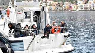 Migrants by the coast of Greece