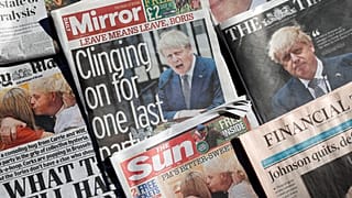 Front pages of British national newspapers, each leading with a front page story of the resignation of Boris Johnson as leader of Britain's Conservative Party, July 8, 2022.