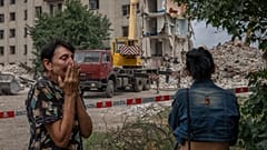 Iryna Shulimova, 59, weeps at the scene in the after math of a Russian rocket that hit a block of flats in Chasiv Yar, Donetsk region, eastern Ukraine, July 10, 2022.