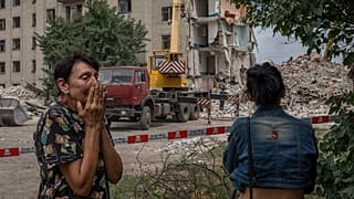Iryna Shulimova, 59, weeps at the scene in the after math of a Russian rocket that hit a block of flats in Chasiv Yar, Donetsk region, eastern Ukraine, July 10, 2022.