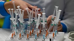 A nurse prepares vaccines in the Wizink Center, currently used for COVID-19 vaccinations in Madrid, Dec. 1, 2021.