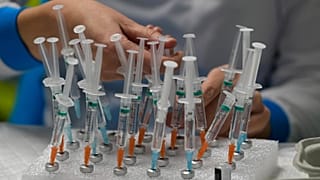 A nurse prepares vaccines in the Wizink Center, currently used for COVID-19 vaccinations in Madrid, Dec. 1, 2021.