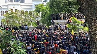 Sri Lankan protesters rally outside prime minister Ranil Wickremesinghe 's office, demanding he resign