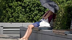 A woman uses an umbrella to shelter from the sun near Hammersmith in London.