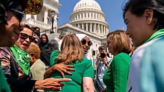 Pro-choice activists and Democratic Representatives gather ahead of the vote on the steps of the Capitol