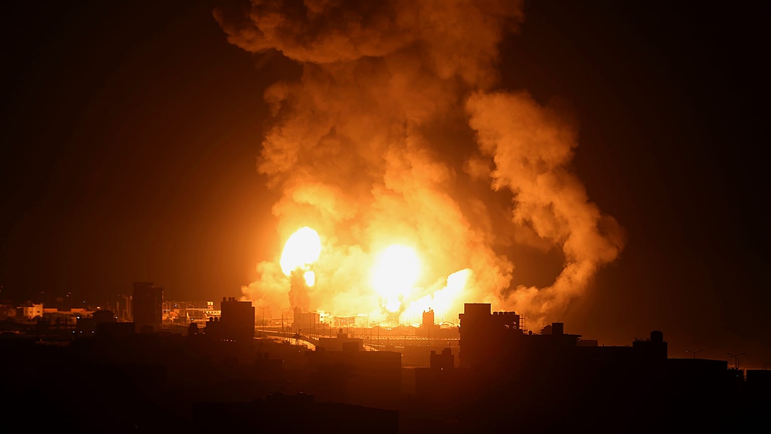 A view of an explosion caused by Israeli airstrikes in Gaza City, 16 July 2022
