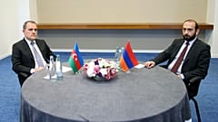 Foreign Minister of Azerbaijan Jeyhun Bayramov and Armenian Foreign Minister Ararat Mirzoyan looking on during a meeting in Tbilisi on 16 July 2022