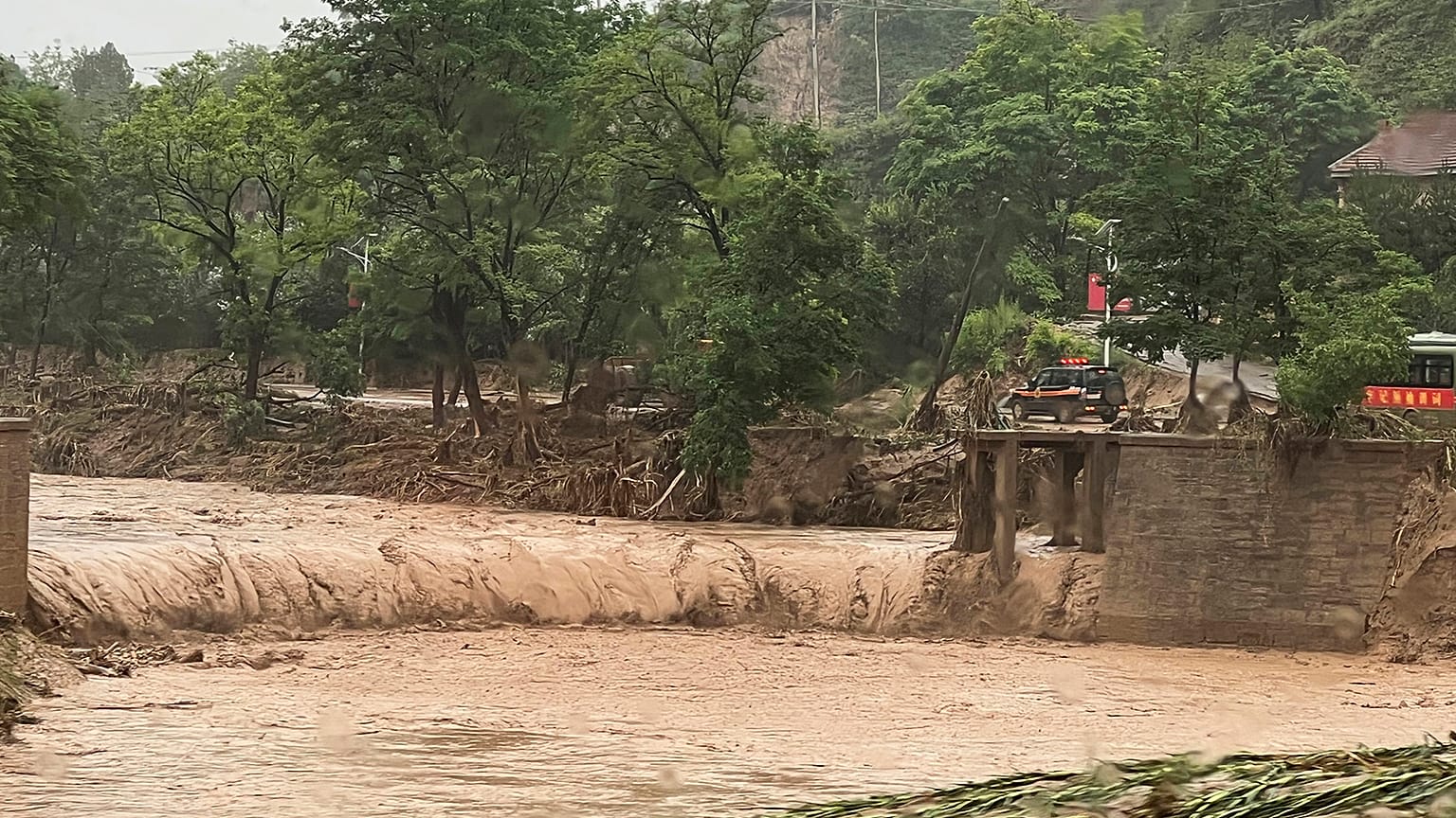 Flash floods kill at least a dozen people in north-west and south-west China
