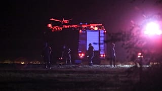 Firefighters are seen near the site of a plane crash, a few miles away from the city of Kavala, 16 July 2022
