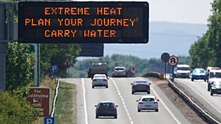 A matrix sign over the A19 road towards Teesside displays an extreme weather advisory as the UK braces for the upcoming heatwave, in England, Saturday July 16, 2022.