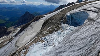 A view taken from a rescue helicopter of the Punta Rocca glacier near Canazei, in the Italian Alps in northern Italy, 