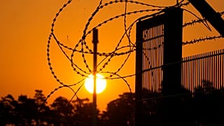 Barbed wir secure the entrance of the harbour area where the landfall of the Nord Stream 1 Baltic Sea pipeline located