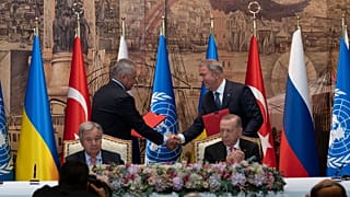 Representatives of Ukraine and Russia delegations shook hands during the signing ceremony in Istanbul