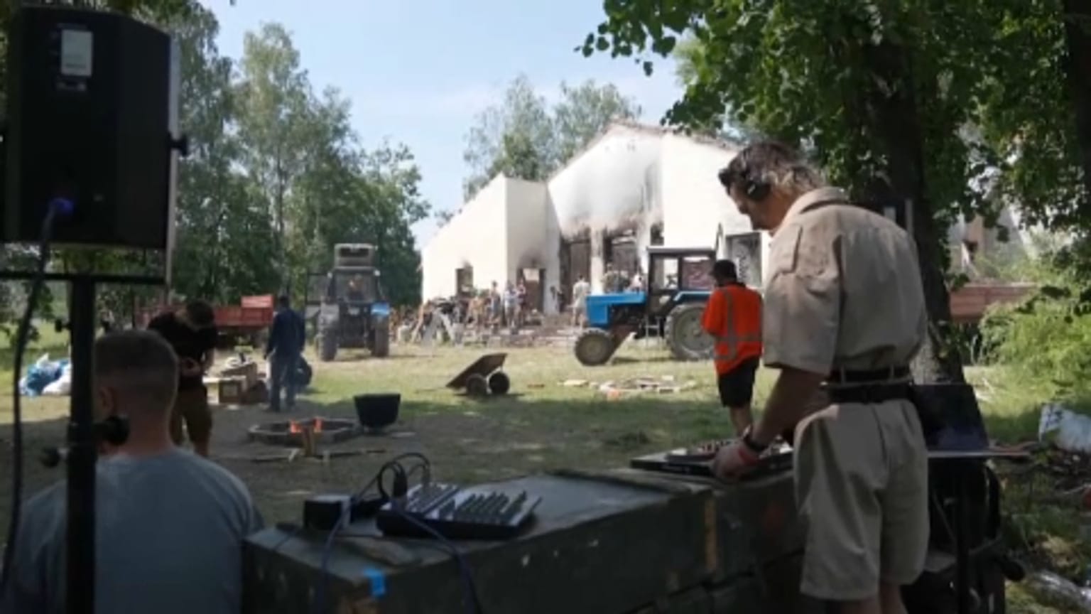 A DJ spins the tunes as volunteers clear up