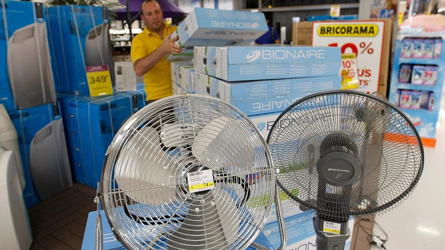 Shop employee restocks air conditioners in Marseille, southern France