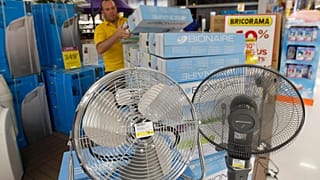 Shop employee restocks air conditioners in Marseille, southern France