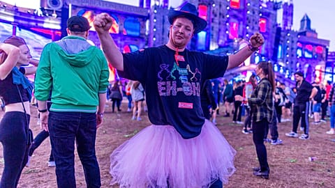 Spectators celebrate in front of the main stage of the electro festival "Airbeat One" in Neustadt-Glewe, Germany, Thursday, July 7, 2022. 