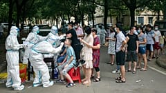 Residents line up to be tested for COVID-19 in Wuhan, 3 August 2021