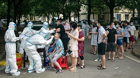 Residents line up to be tested for COVID-19 in Wuhan, 3 August 2021