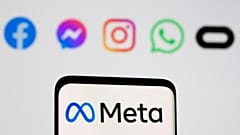 Facebook's rebrand logo Meta is seen on a smartphone in front of the logos of Facebook, Messenger, Intagram, WhatsApp, Oculus in this file photo taken October 28, 2021.