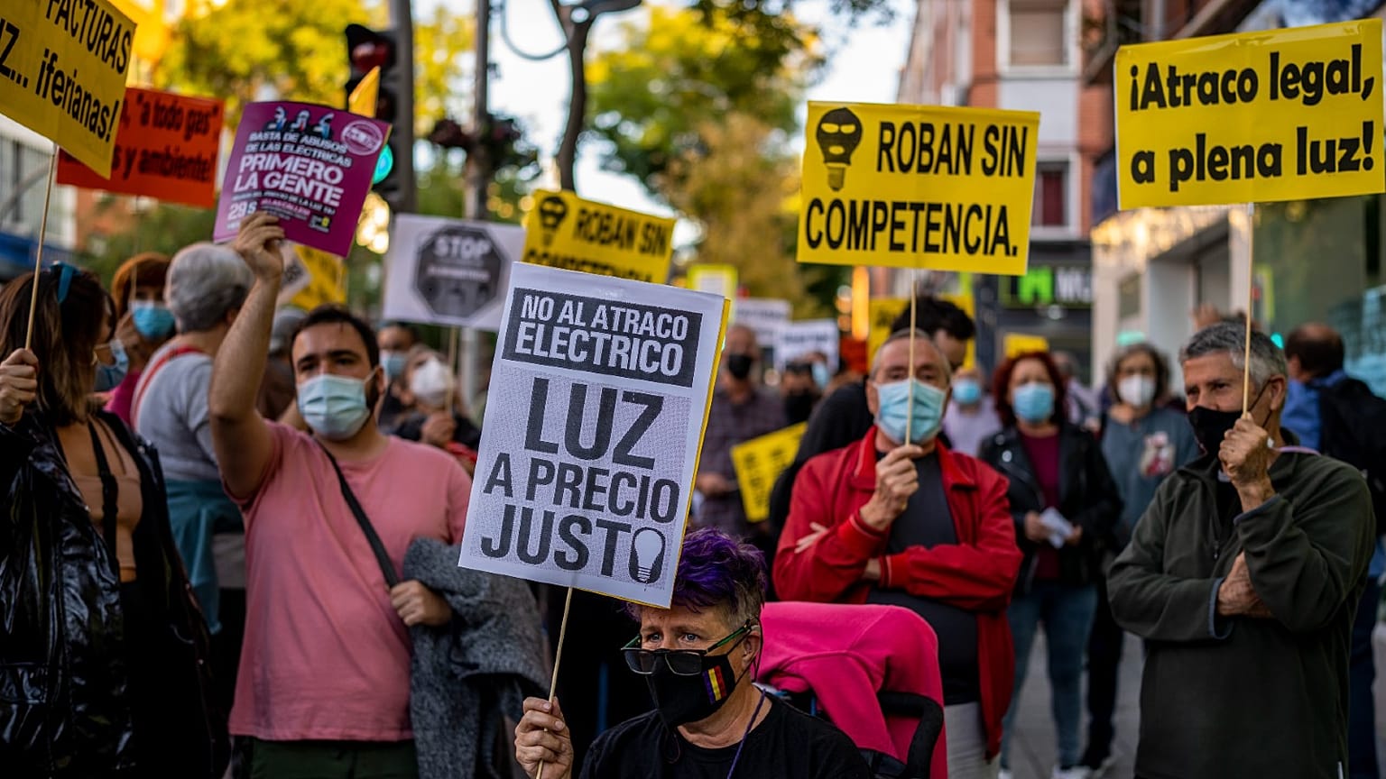People take part in a protest against the increase of the price of electricity in Madrid, Spain, Oct. 6, 2021.