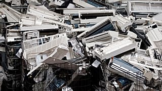 Parts of air-conditioning devices at a recycling facility in 2013
