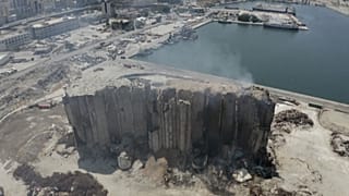 smoke billows from grain silos in Beirut port