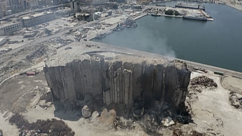 smoke billows from grain silos in Beirut port
