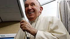 Pope Francis speaks to journalists aboard the papal flight back from Canada Saturday, July 30, 2022