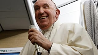 Pope Francis speaks to journalists aboard the papal flight back from Canada Saturday, July 30, 2022