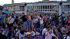 FILE - England supporters at a Euro 2022 Fan Zone in Trafalgar Square, London