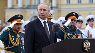 Russian President Vladimir Putin, center, delivers his speech prior to the military parade during Navy Day celebrations on the Neva River, St.Petersburg, 22 July 2022
