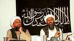 Ayman al-Zawahri, left, listens during a news conference with Osama bin Laden in Khost, Afghanistan. 