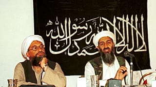 Ayman al-Zawahri, left, listens during a news conference with Osama bin Laden in Khost, Afghanistan. 