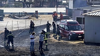 Firefighters intervene to extinguish a fire at the Cinecittà studios southeast of Rome