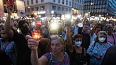 A candlelit memorial for Lisa-Maria Kellermayr, the deceased doctor who reported receiving threats from opponents of COVID-19 restrictions and vaccines, Vienna, Aug. 1, 2022.
