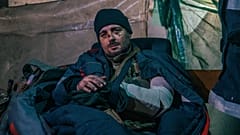 In this photo provided by Azov Special Forces Regiment of the Ukrainian National Guard Press Office, an injured Ukrainian soldier poses for a photo in Azovstal steel plant.